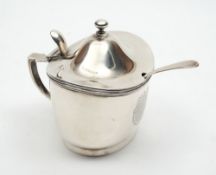 An Edward VII silver oval mustard pot, maker Garrard & Co, London, 1906: crested,