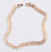 A 9ct gold fringe necklace:, approximately 55gms gross weight.