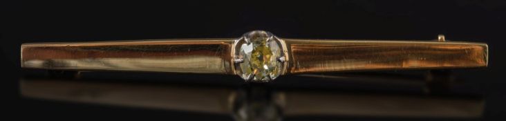 A gold and diamond single stone bar brooch:, the cushion shaped, old-cut stone approximately 0.