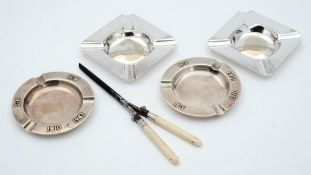 A pair of silver ashtrays and a pair of plated ashtrays, a pair of curling tongs:.