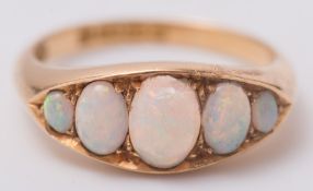 An 18ct gold and graduated opal five stone ring:.