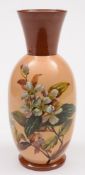 A Watcombe (Torquay) pottery vase: of slender oviform with raised flaring neck,