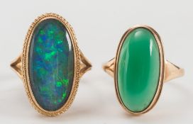 A gold and oval opal triplet single-stone ring and a chrysoprase single-stone ring:.