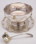 A large plated punch bowl: with gadrooned rim, garland decorated sides with lion mask ring handles,