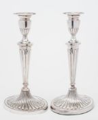 A pair of Elizabeth II silver candlesticks, maker D.J.