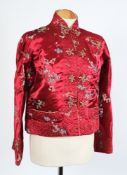 A Chinese navy blue silk frock coat, a similar black coat, two short jackets and a chiffon dress:.