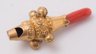 A gilt metal and coral rattle: approximately 41mm long.