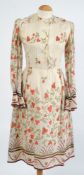 A Belinda Bellville cream and poppy red floral dress:.