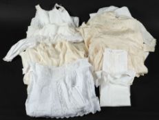 A collection of child's bed gowns, undergarments, vests and other textiles:.