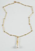 A single cultured pearl pendant suspended on an 18ct gold chain of rod-like linking:.