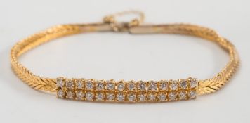 A diamond mounted bracelet: of herring-bone linking,