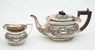 A matched silver two-piece tea service,