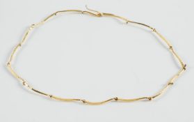 An 18ct gold necklace of hammered tapering linking:.