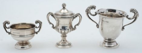 Three assorted silver miniature trophy cups, various makers and dates: total weight of silver 8.