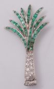 An emerald and diamond mounted 'palm tree' brooch:,