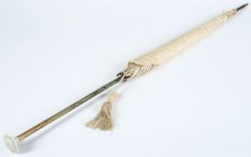 A silk parasol with faux bamboo and jade handle:.