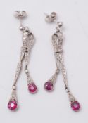 A pair of 20th century ruby and diamond drop earrings: each suspending two circular rubies and