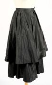 A Jaeger black pleated skirt, together with a Saree turquoise skirt, one other long skirt,
