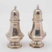 A pair of Victorian silver pepperettes, maker J R Ltd, Birmingham, 1898:, of traditional outline,