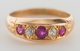 An Edwardian 18ct gold, ruby and diamond five-stone ring:.