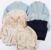 A group of eight cashmere and beaded cardigans:, etc.