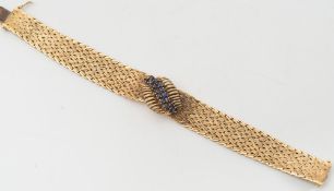 An 18ct gold and sapphire mounted mesh-link bracelet: with loose clasp fitting.
