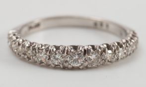 A platinum & diamond half eternity ring: with fifteen graduated circular diamonds with brilliant