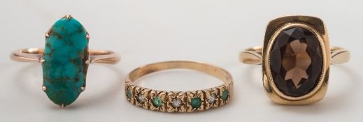 A smokey quartz single stone ring, an oval turquoise single stone ring and a half hoop ring:.