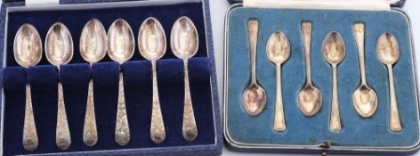 Two sets of six silver coffee spoons: both cased, total weight of silver 3.34ozs.