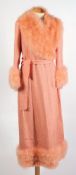 A Marshall & Snelgrove pink silk and faux feather coat:.