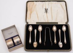 A set of six George V silver coffee spoons and a pair of sugar tongs, maker Elkington & Co,