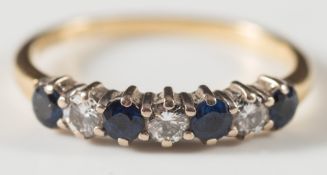 A gold, sapphire and diamond half hoop ring:.
