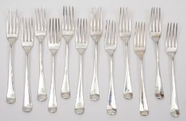 A collection of twelve Georgian silver Hanoverian pattern dessert forks:,various makers and dates,