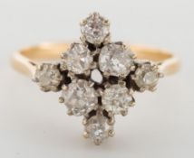 A diamond mounted lozenge-shaped cluster ring: with round old brilliant-cut diamonds estimated to