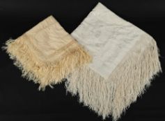 An ivory silk shawl with embroidered floral decoration with fringe border and another similar:.