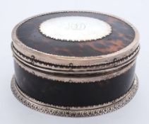 A late Victorian tortoiseshell and silver mounted box: of oval outline,