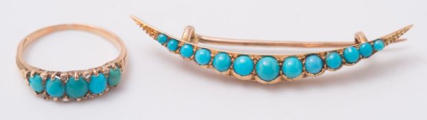 A turquoise and diamond five stone ring with diamond points and a turquoise mounted crescent