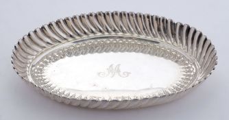 A Victorian silver oval dish, maker Richard Martin & Ebenezer Hall, London, 1884: initialled,