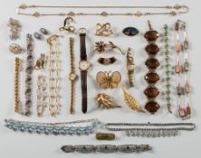 A quantity of jewellery and costume jewellery to include a 'Trifari' brooch, paste-set necklaces,