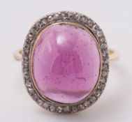 A garnet and diamond sugar loaf ring:, the oval,