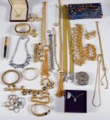 A quantity of costume jewellery to include gold coloured jewellery,