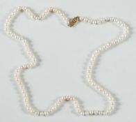 A freshwater, cultured pearl, single string necklace:, with marquise shaped clasp of pierced design.