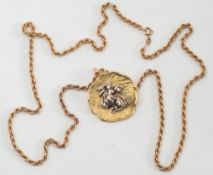 A circular pendant/brooch of textured design depicting female Arabian water carrier:,