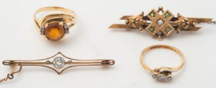 A diamond three stone ring, an amber coloured gem stone ring,