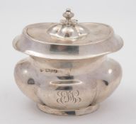 An Edward VII silver tea caddy, maker Richard Martin & Ebenezer Hall, Chester, 1909:, initialled,