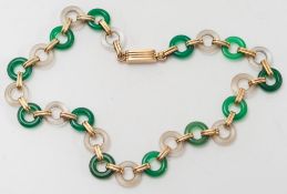 A chrysoprase, quartz crystal and yellow metal circular-link necklace:.