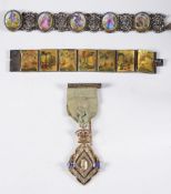 A silver, silver gilt and paste-set Masonic medal in fitted case:, together with a Persian style,