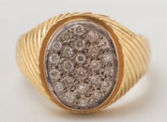 A gentleman's 18ct gold and diamond oval cluster ring:, approximately 17gms gross weight.
