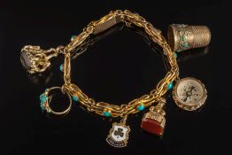 A 9ct gold and turquoise mounted bracelet: with six various attached gold charms including a