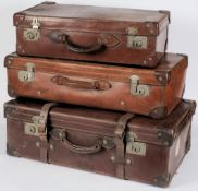 A large leather suitcase and two other suitcases: (3)